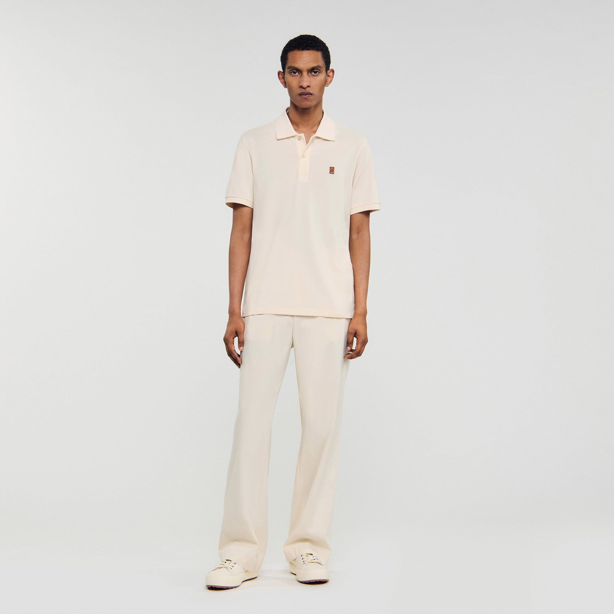 Polo shirt with leather logo