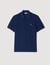 Polo shirt with leather logo