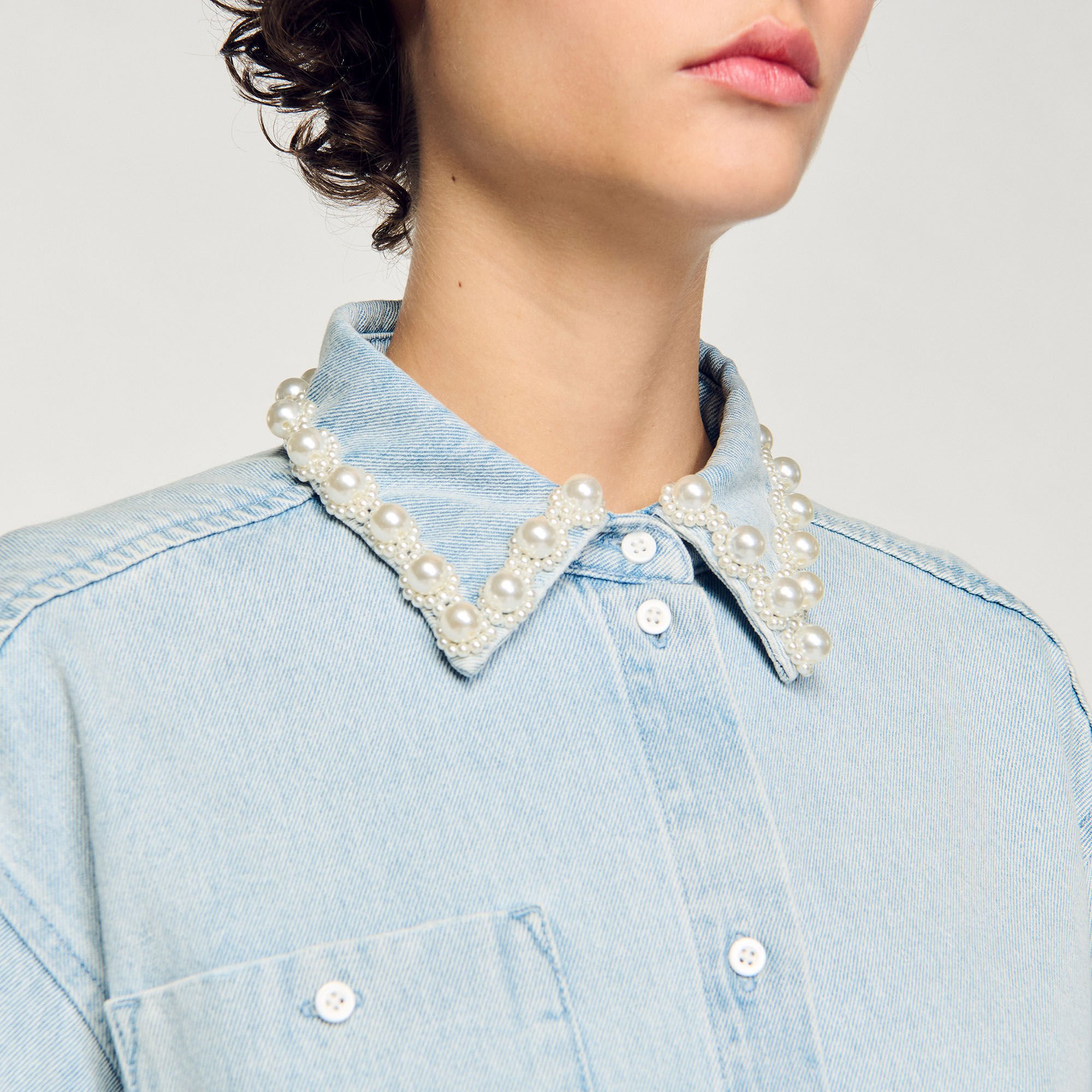 Denim shirt with beaded collar