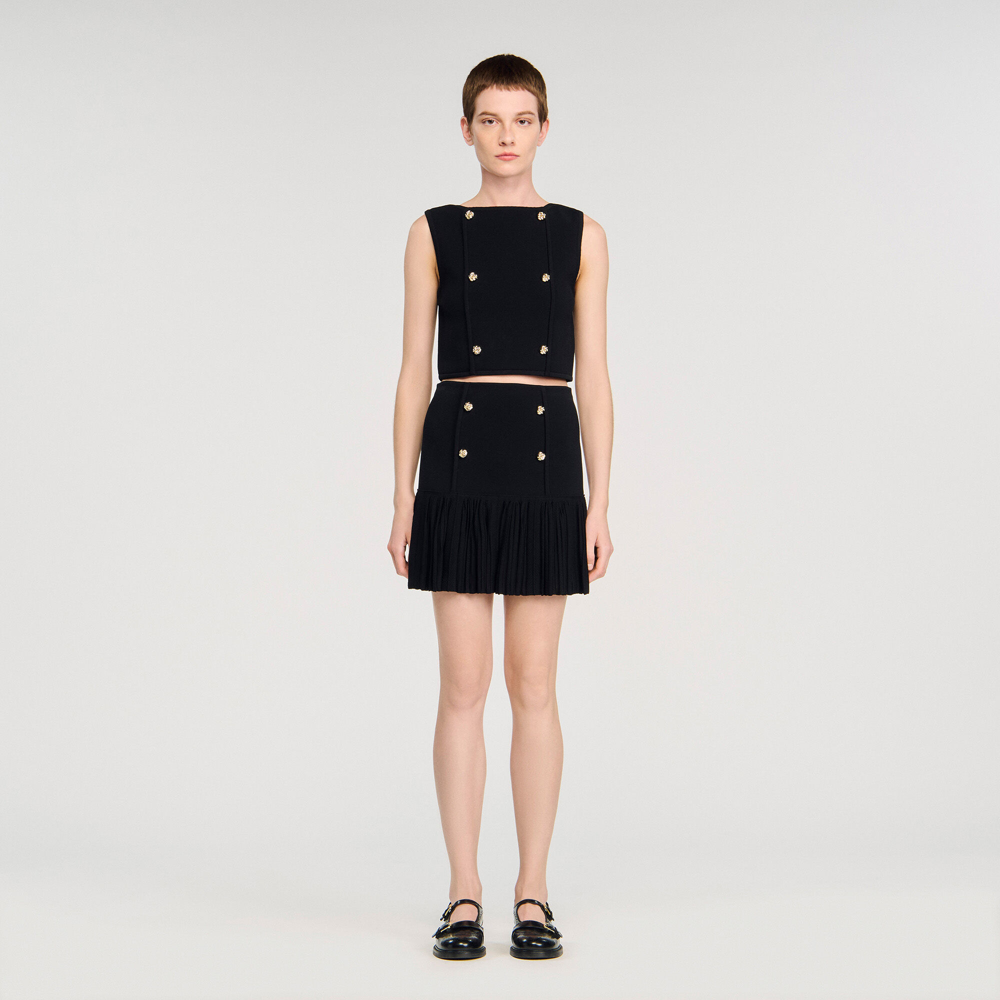 Short pleated knit skirt