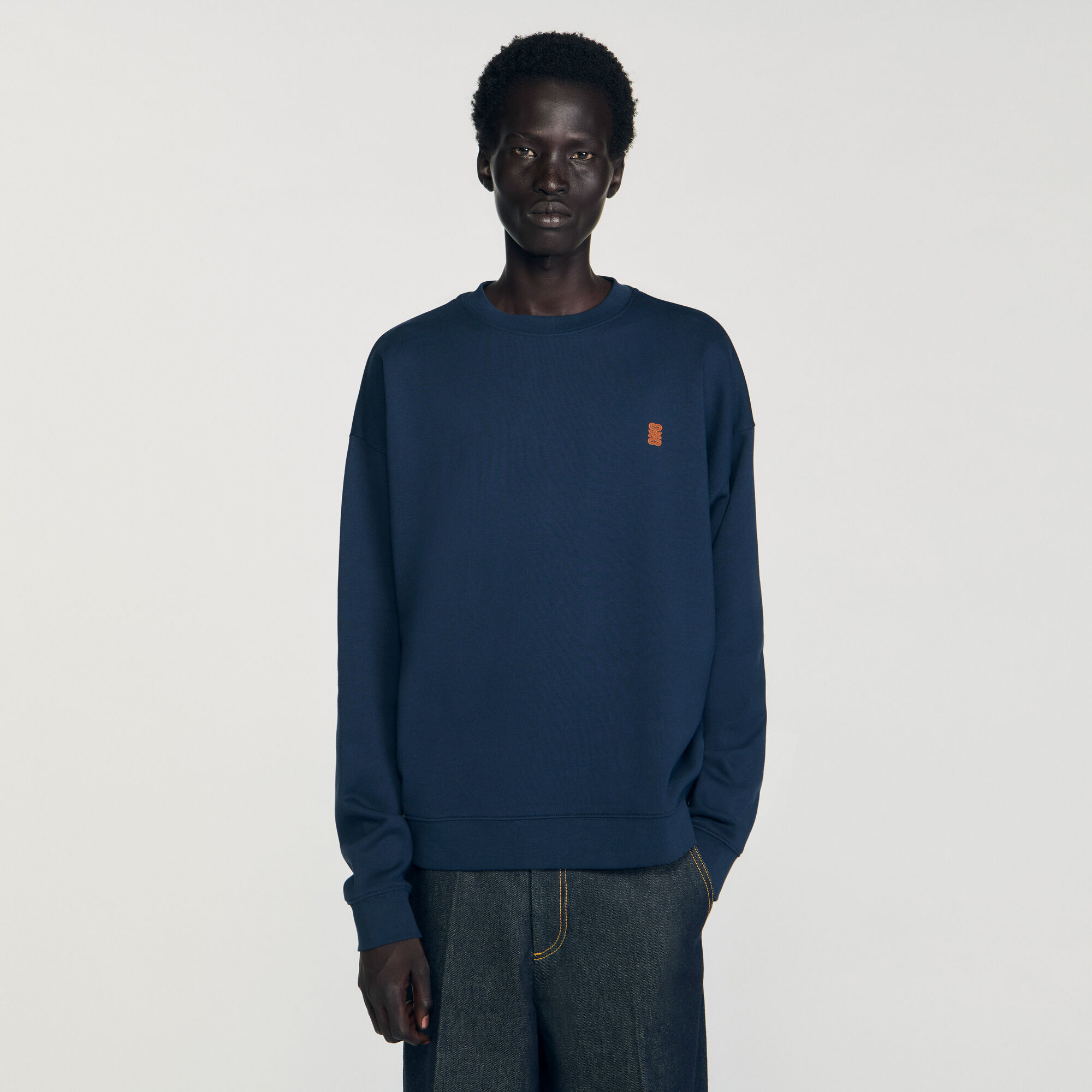 Oversized sweatshirt with leather patch