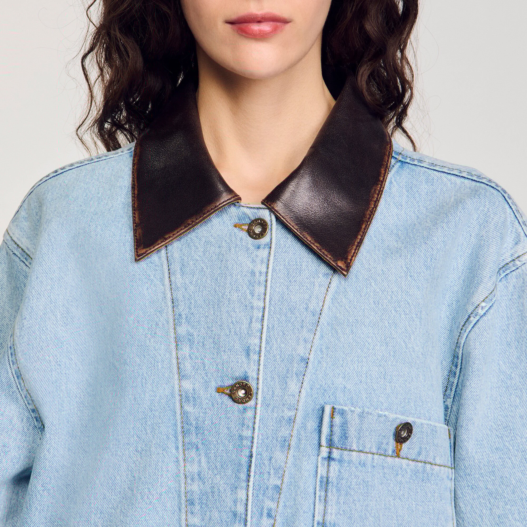Denim jacket with leather collar