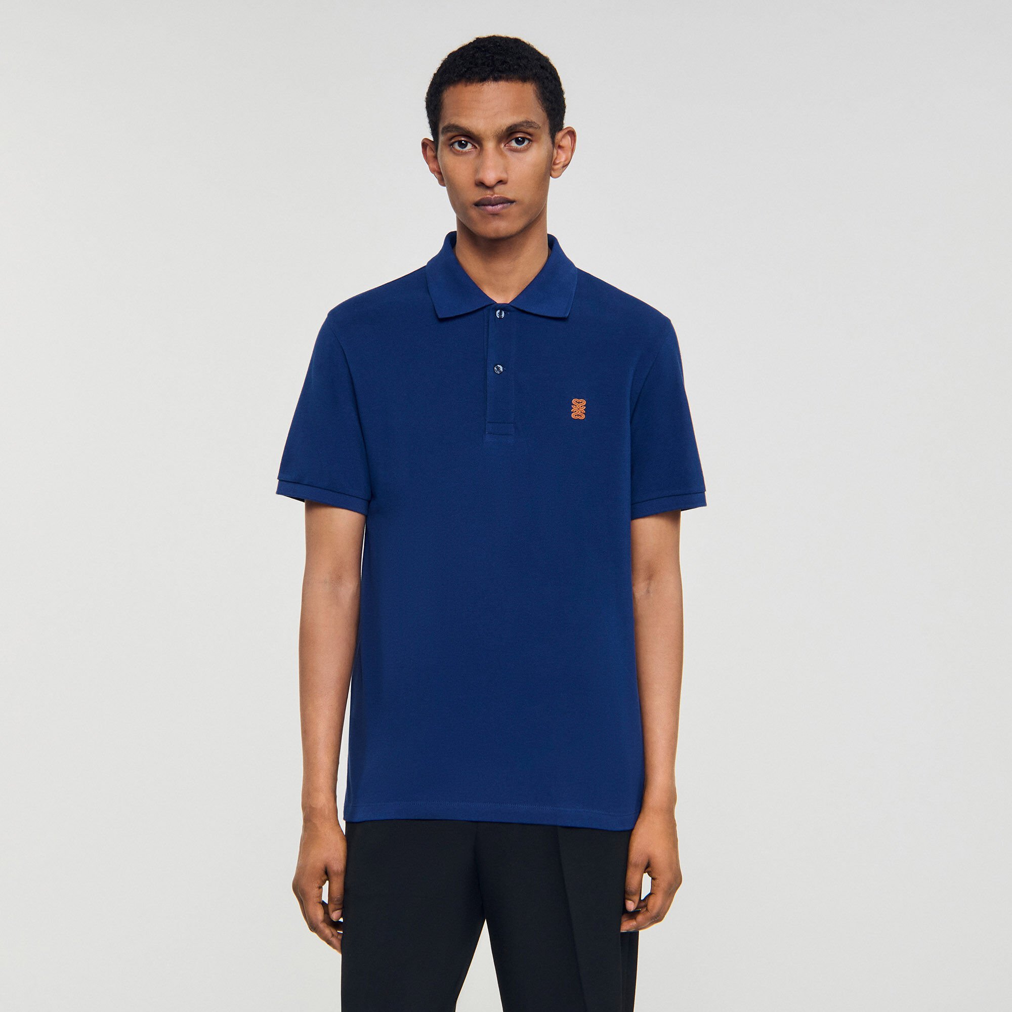 Polo shirt with leather logo