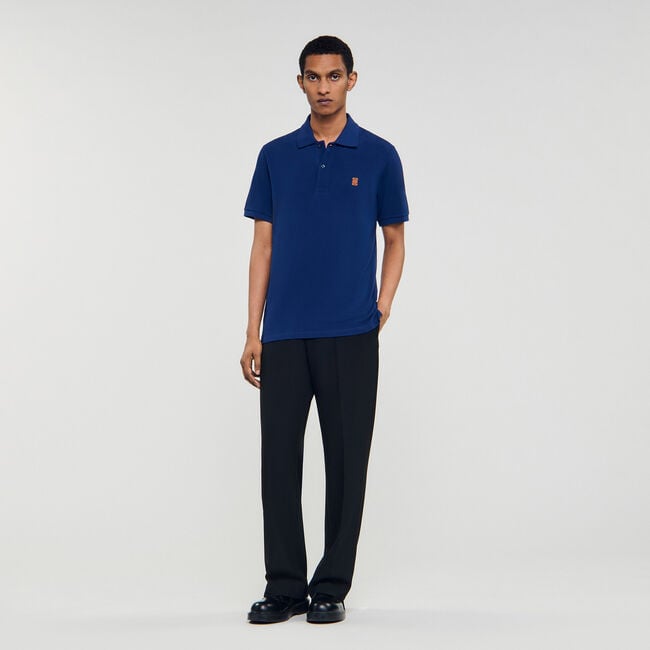 Polo shirt with leather logo