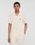 Polo shirt with leather logo