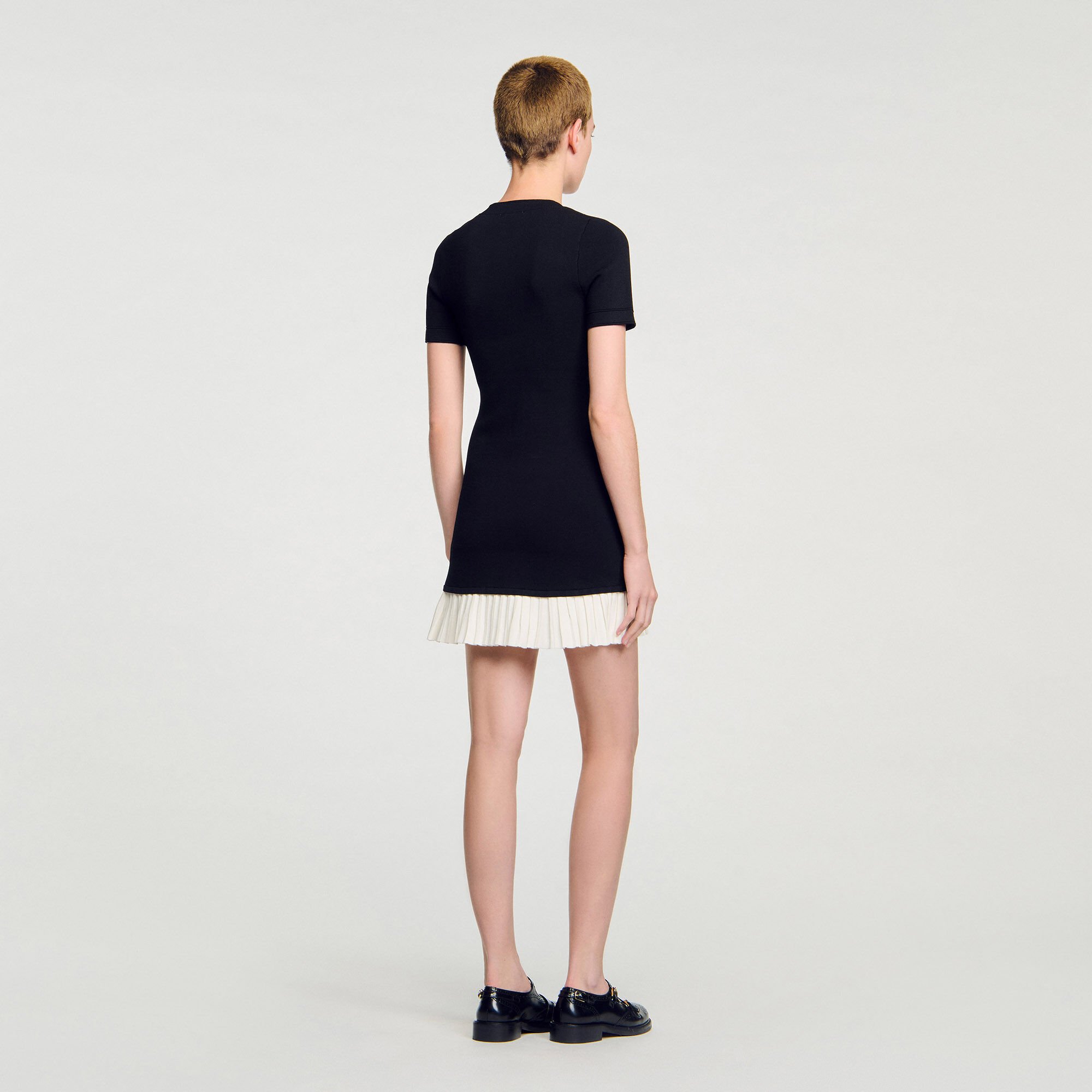 Short knit dress with ruffle